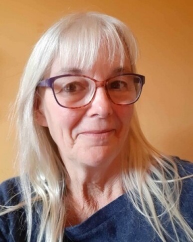 A selfie of a woman wearing glasses.
